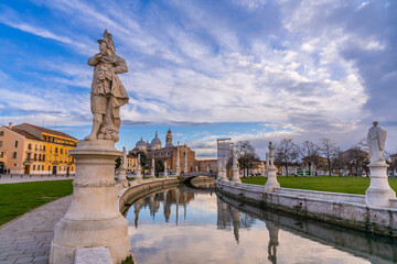 Fototapeta na wymiar Padua, Italy - January 22 2023 - Tourists visiting the Ancient Roman Fountains on the Prato della Valle