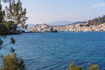 Naklejka na ściany i meble Poros, Greece - 17 February 2023 - View on the town of Poros on Poros island seen from the mainland
