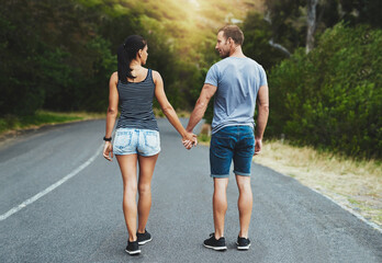 Obraz premium Street, love or happy couple holding hands or walking on date with trust, care for romance or adventure. Loyalty, road or man with woman on holiday vacation together for bond, support or wellness