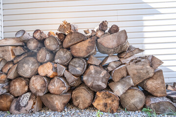 Stack of firewood behind a house