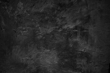 Textured black grunge background. Black concrete texture as a concept of horror and Halloween