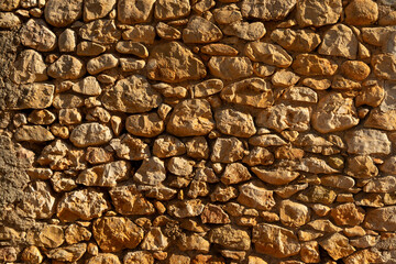 Detail shot of a plain limestone wall - stock photo