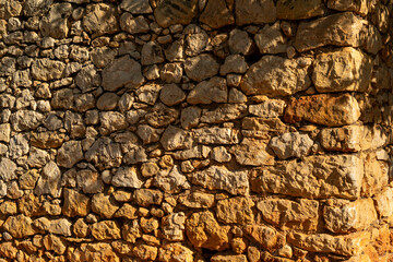 Detail shot of a plain limestone wall - stock photo