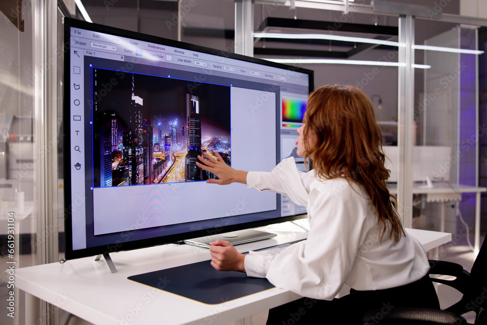 Aufkleber designer editing photo on computer