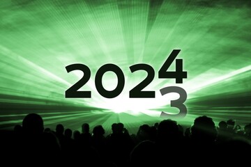 Turn of the year 2023 2024 green laser show party. Luxury entertainment with people crowd audience silhouettes at new year celebration. Premium nightlife event at holidays season time - 661931707