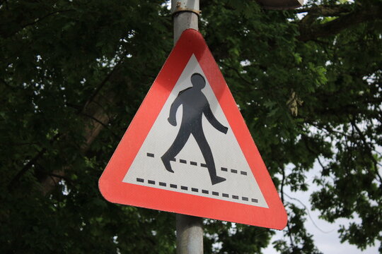 Zerba crossing sign warning motorists of crossing pedestrians ahead