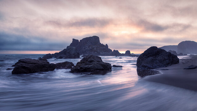 Late Afternoon at Harris Beach in Brookings Oregon, USA, featuring purple and magenta sunset tones.