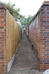 A long alley way at the back of a housing block