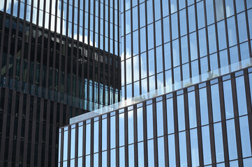 Fototapeta na wymiar blue skyscraper glass and metal texture. contemporary modern facade. 