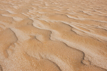 Lateral macros of the Rub Al Khali desert sand with a golden orange colour.