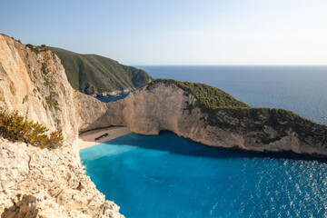 Beautiful view of a deserted beach with a sunken ship.
