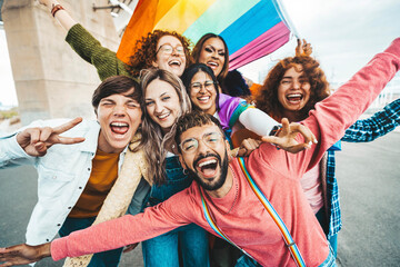 Diverse group of cheerful young people celebrating gay pride day - Lgbt community concept with guys and girls hugging together outdoors - obrazy, fototapety, plakaty