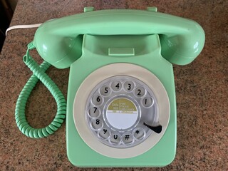Picture of a vintage green rotary phone