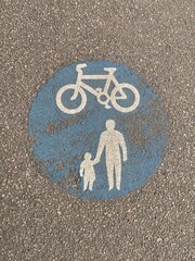 Worn UK road sign marking a shared route for pedal cycles and pedestrians 