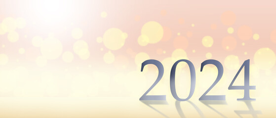 Metal numbers 2024 on a white table with Christmas trees and bokeh lights