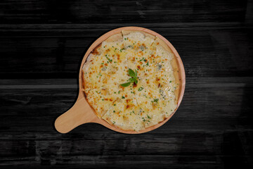 Top view of Homemade Pizza Cheese on wood table background