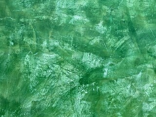 Green plaster wall with crackle texture background in Oaxaca, Mexico.