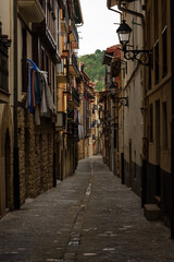 Narrow street in Getaira old town on a cloudy day, Gipuzkoa, Basque Country, Spain, Europe