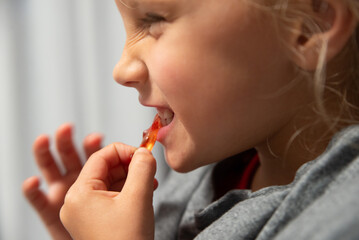 the girl is eating jelly