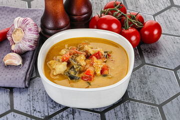 Traditional yellow Thai curry with chicken