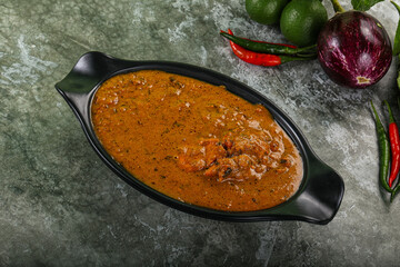 Indian cuisine - chicken curry with spices