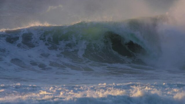 huge stormy wave crashing in the ocean