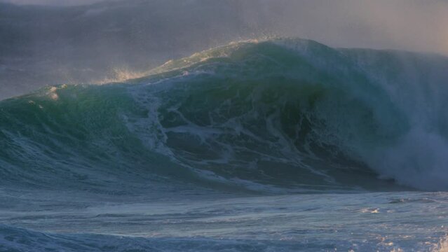 huge stormy wave breaking in slow motion