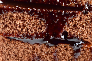 Close Up of chocolate cake sliced with choco syrup