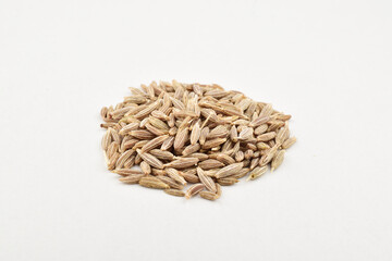 Closeup of cumin seeds on white background