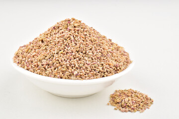 Closeup of carom seeds on white background