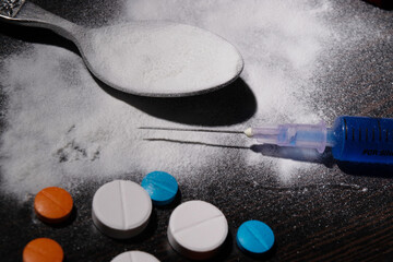 Closeup of cocaine and injection, illegal drugs