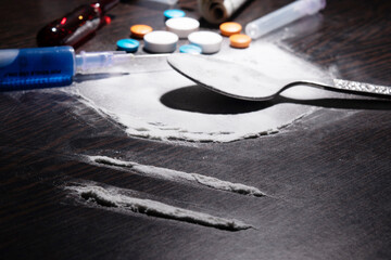 Closeup of cocaine with spoon and syringe