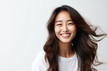 Fototapeta premium A cheerful and stylish young woman with a cute smile, exuding happiness and confidence in her portrait.