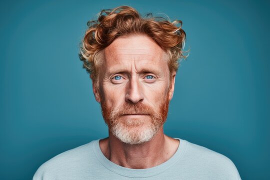 An expressive portrait of a mature and serious Caucasian man with a beard, conveying a sense of confusion and uncertainty.