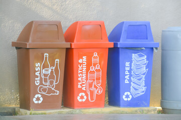 The outdoor recycle bin serves as a designated category for rubbish and waste, promoting environmentally responsible disposal practices - obrazy, fototapety, plakaty