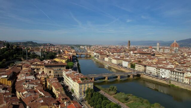 Italy, great landmarks and towns - city of art and culture- Florence, panoramic view of city center and old bridge Ponte vechio, aerial drone view