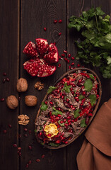 Georgian salad Tbilisi, boiled beef, with red beans and onions, sweet pepper, walnut and pomegranate, homemade, no people,