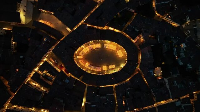 Piazza dell'Anfiteatro, aerial view of the main square in Lucca, night evening, Tuscany, Italy