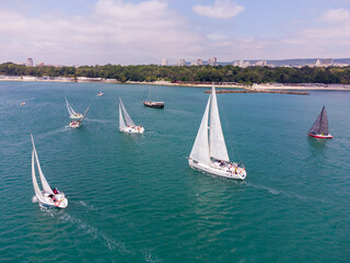 Aerial view of sailing yachts regatta race on sea