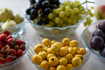 various fruit on a white table. healthy eating concept.