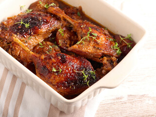 Spicy thyme duck legs with plums