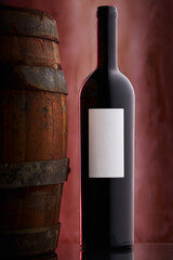 red wine bottle and barrel on dreamy back drop rose