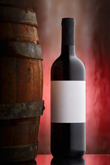 red wine bottle and barrel on dreamy back drop rose