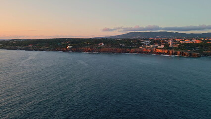 Obraz premium Resort city serene coast panoramic landscape. Seaside town tranquil sea shore