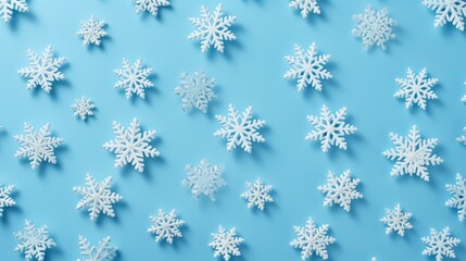 white snowflakes on light blue background