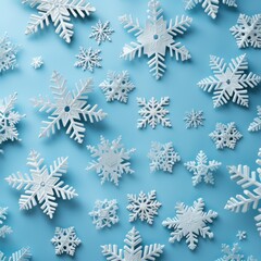 white snowflakes on light blue background