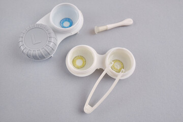 Container for lenses and accessories on a light background. Health and medicine concept
