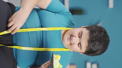 Vertical Video of Obesity boy focus on slimming.
