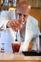 master bartender showing all the perfection of his work