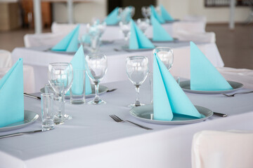 Set table with plates, glassesy, cutlery and napkins